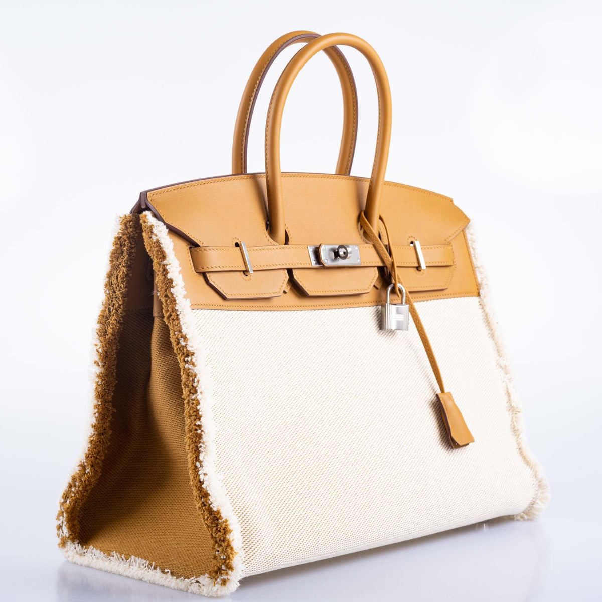 Hermès Fray Fray Birkin 35 Sesame Swift and Toile H with Palladium Hardware, three-quarter view from the left
