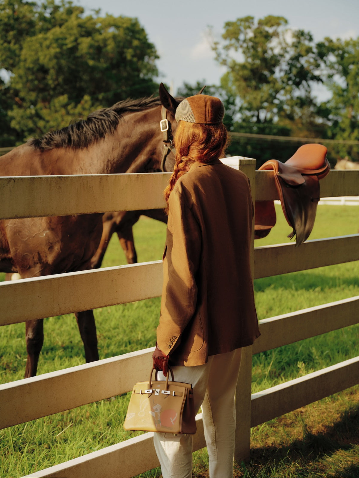 Hermès In and Out Birkin 25 Biscuit Printed Swift Palladium Hardware, carried by a model beside a horse