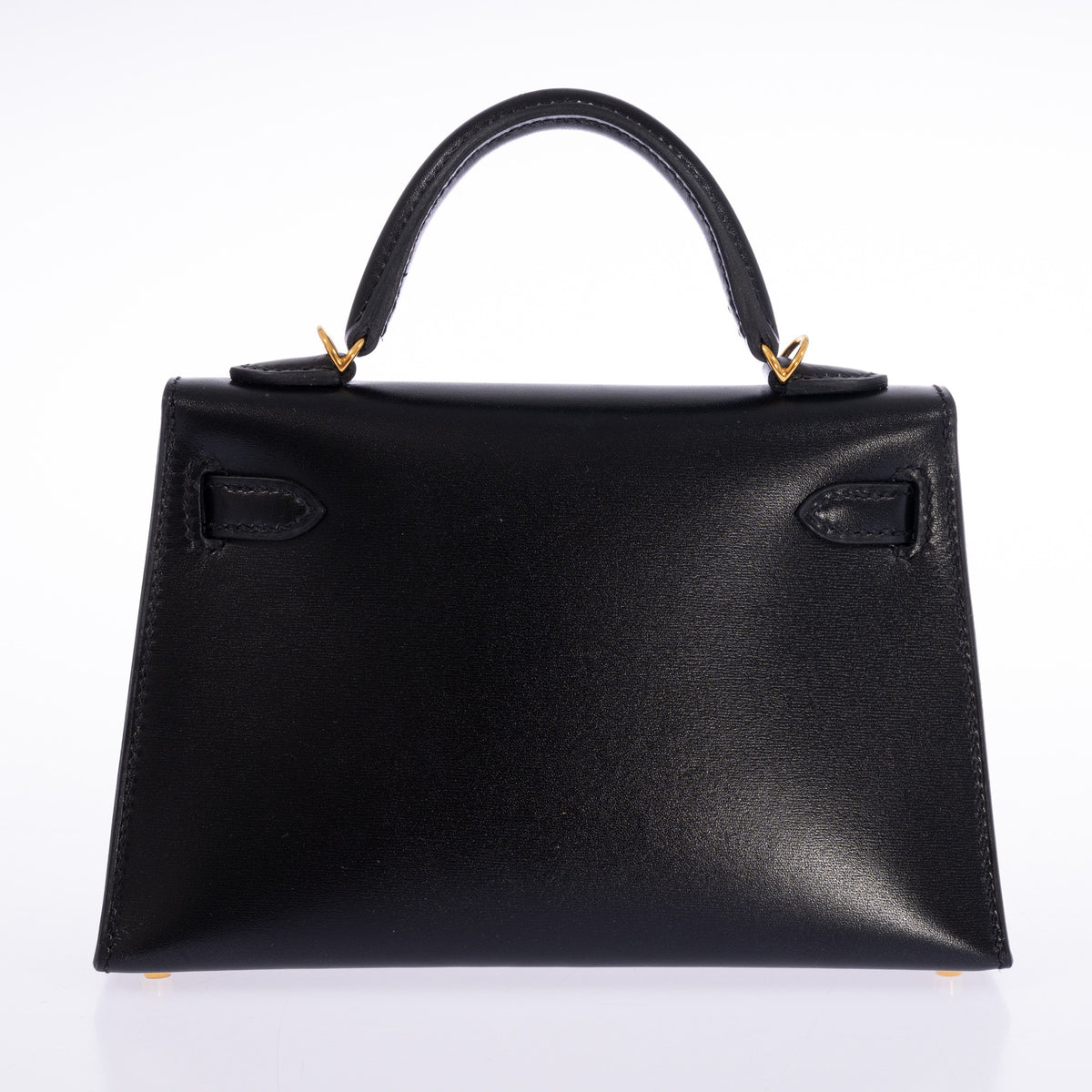 Hermès Kelly 20 Mini II Sellier in Noir Box calf with gold hardware, rear view showing the top handle and sangle attachments.