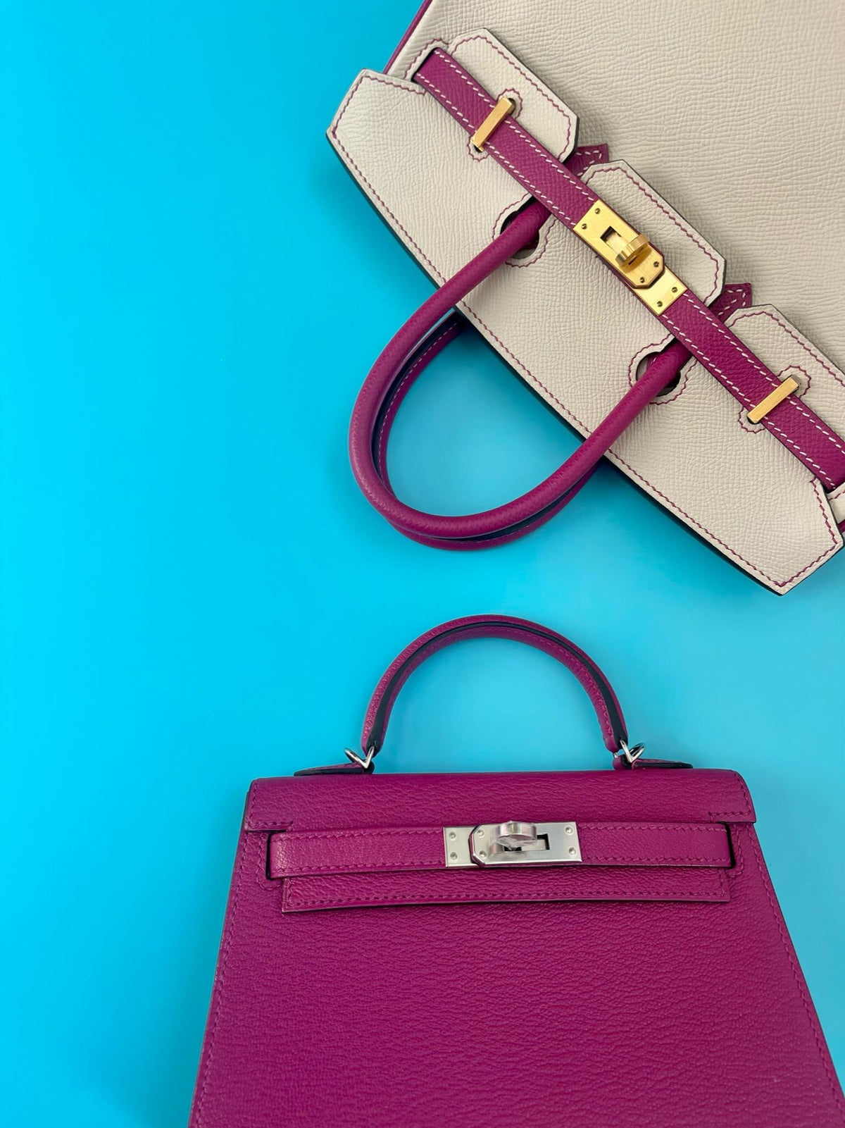 Hermès Kelly 20 Mini II Sellier Rose Pourpre Chevre Leather Palladium Hardware, flat lay front view beside a Rose Pourpre Kelly