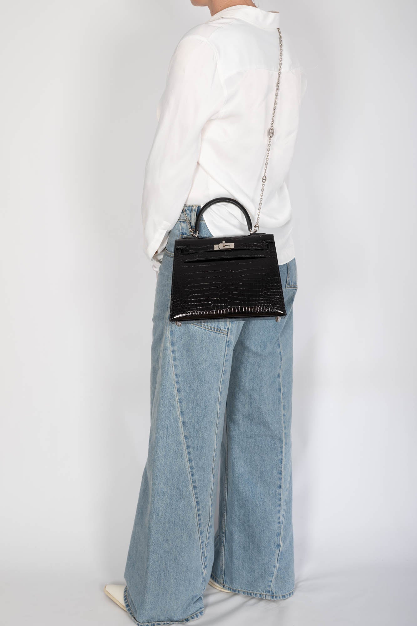 Hermès Kelly 25 Sellier Noir Shiny Porosus Crocodile Palladium Hardware
