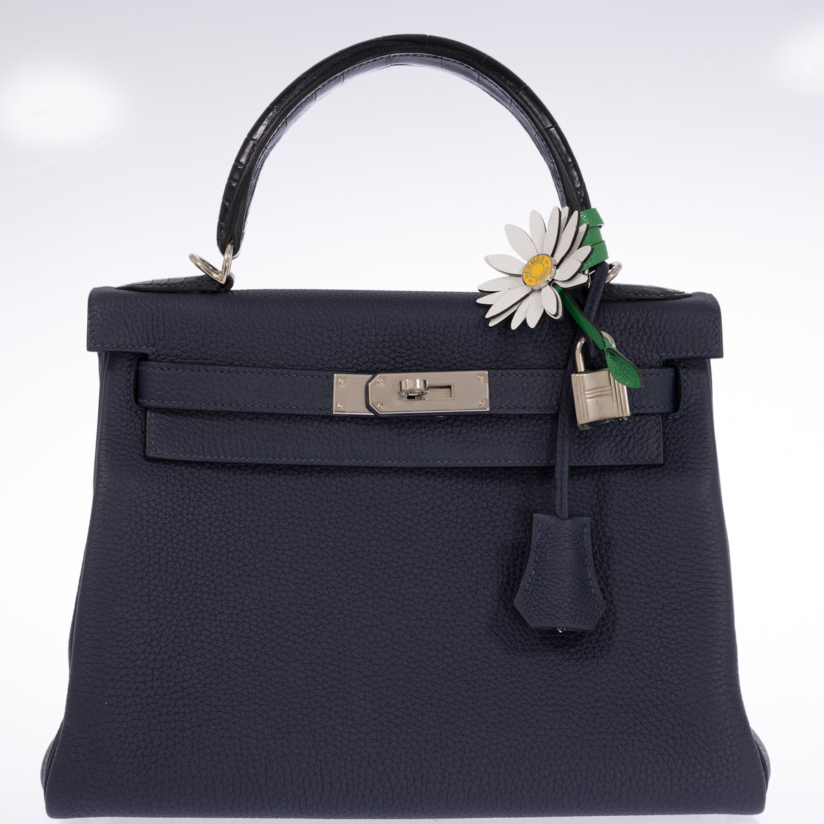 Hermès Kelly 28 Retourne Touch Bleu Nuit Togo and Bleu Marine Alligator Palladium Hardware, front view with lock and clochette, styled with a daisy charm, sold separately