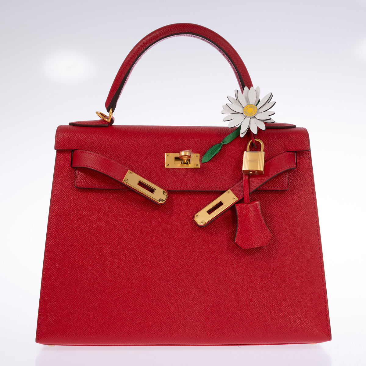 Hermès Kelly 28 Sellier Rouge Casaque Epsom Gold Hardware, front view with the sangles open and a marguerite charm on the handle, charm sold separately
