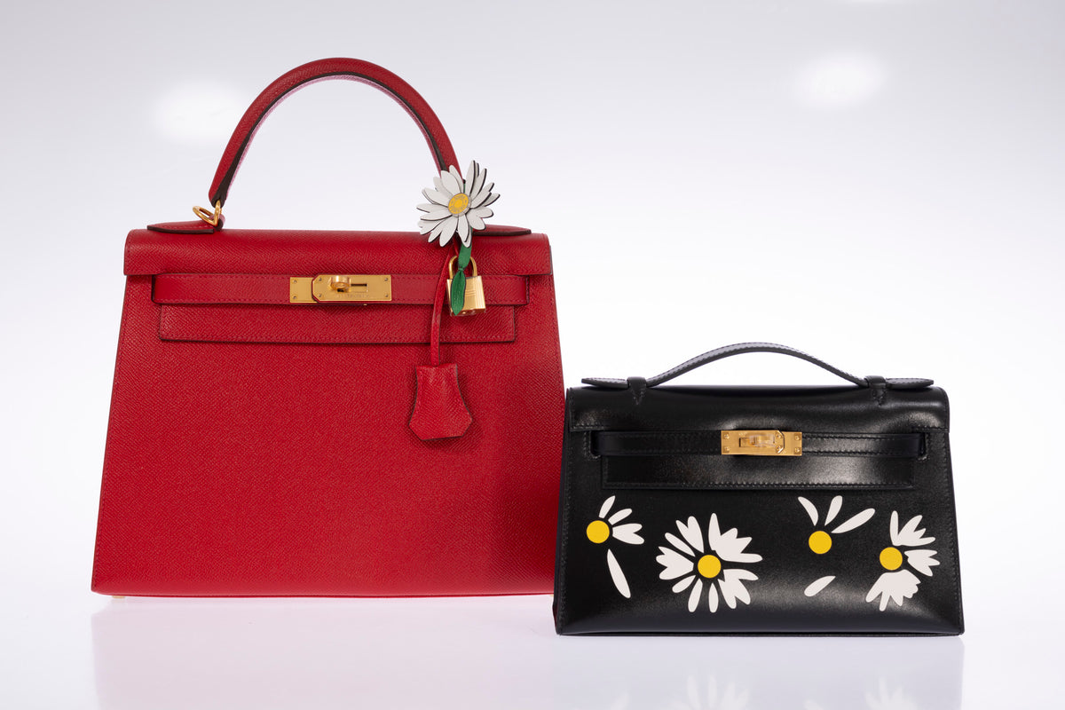 Hermès Kelly 28 Sellier Rouge Casaque Epsom Gold Hardware, shown alongside a Kelly Pochette with a marguerite charm, other bag and charm sold separately