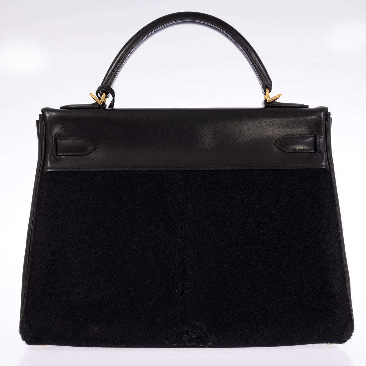 Hermès Kelly 32 Noir Box leather and pony skin with Gold hardware, full back view showing the pony-skin panel and leather trim.