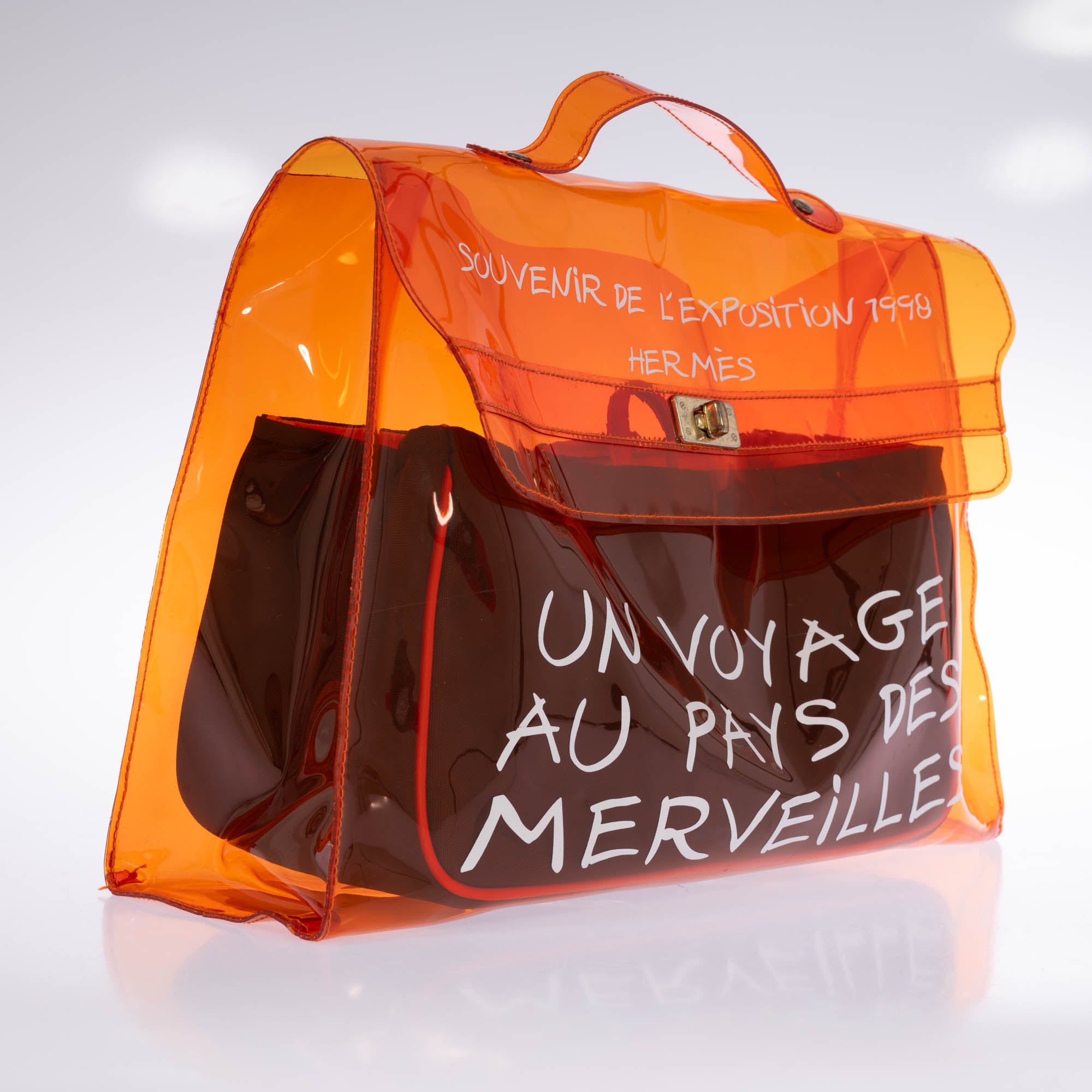 Hermès Kelly 40 Orange Translucent Vinyl Souvenir de l'Exposition 1998 bag, three-quarter view