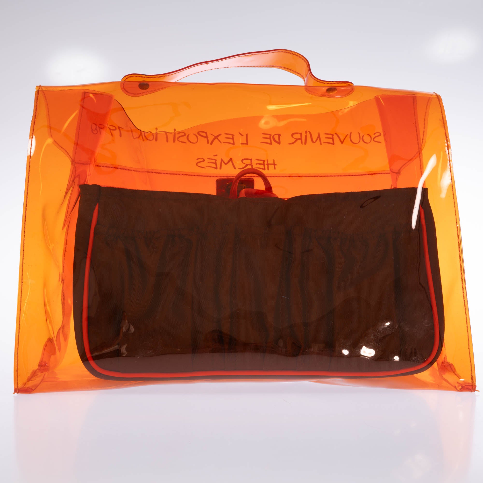 Hermès Kelly 40 Orange Translucent Vinyl Souvenir de l'Exposition 1998 bag, back view with printed canvas insert