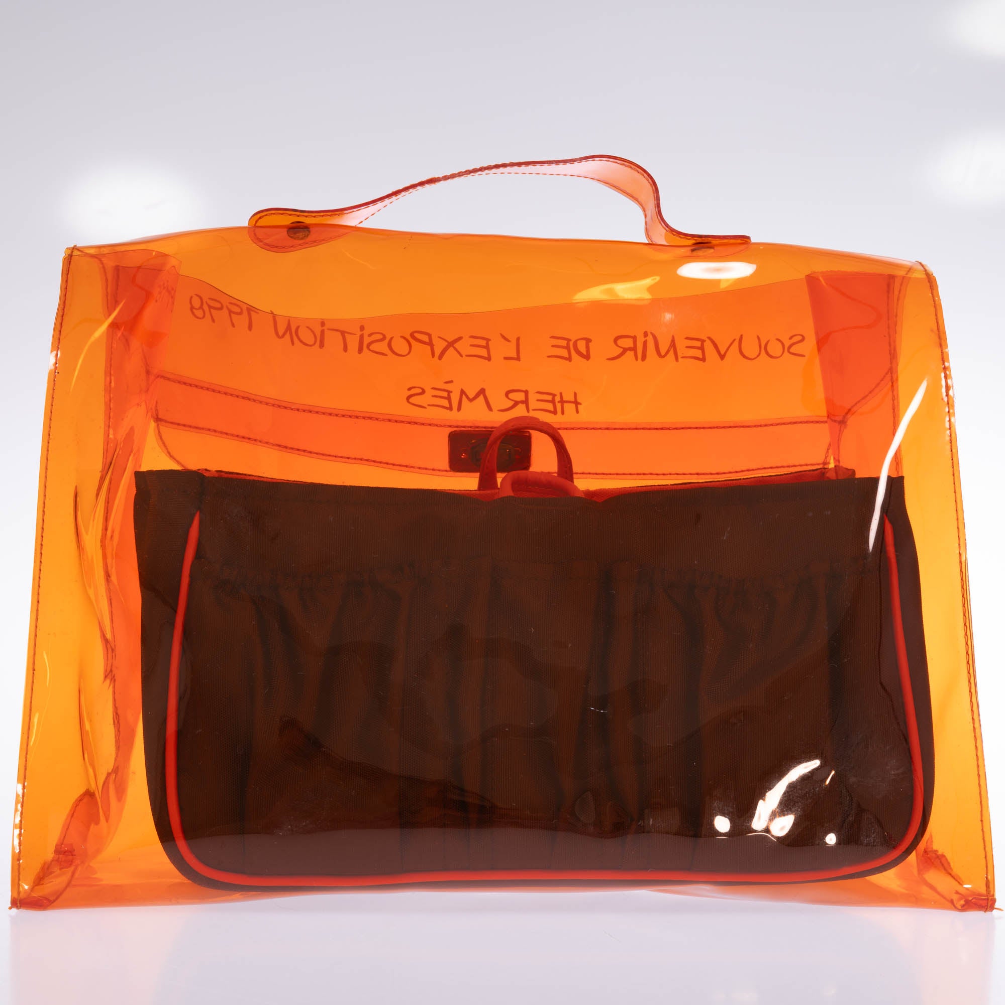 Hermès Kelly 40 Orange Translucent Vinyl Souvenir de l'Exposition 1998 bag, angled back view