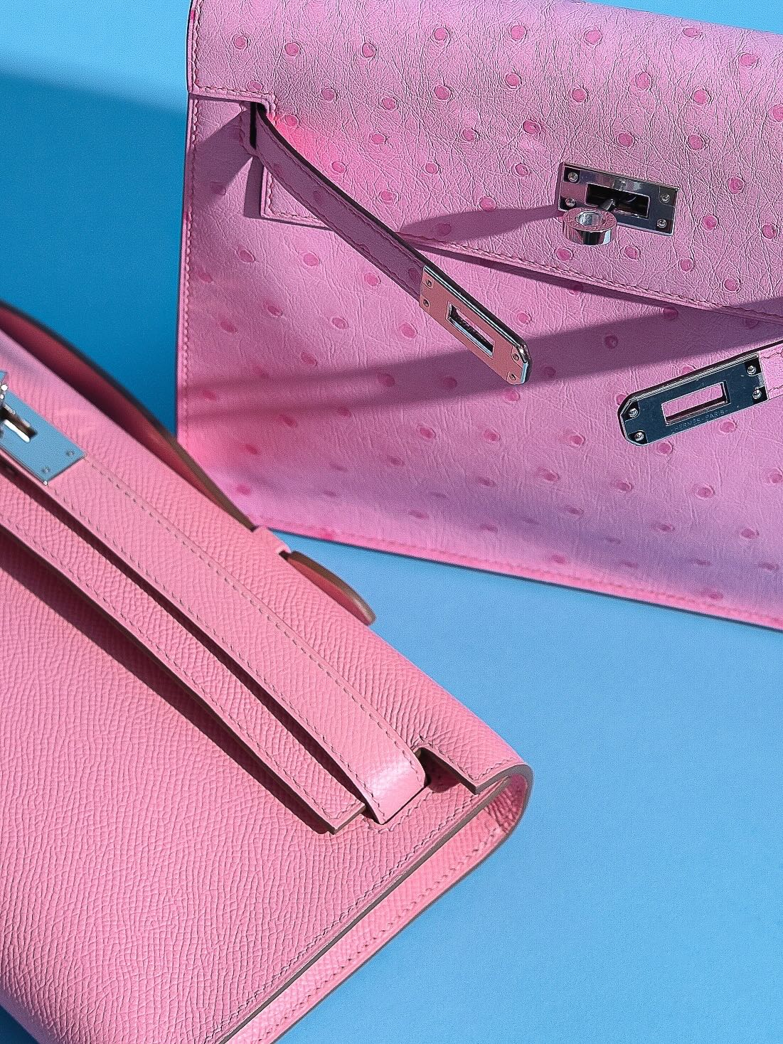 Hermès Kelly Cut Rose Confetti Epsom leather Palladium Hardware, flat lay close view beside a pink ostrich piece