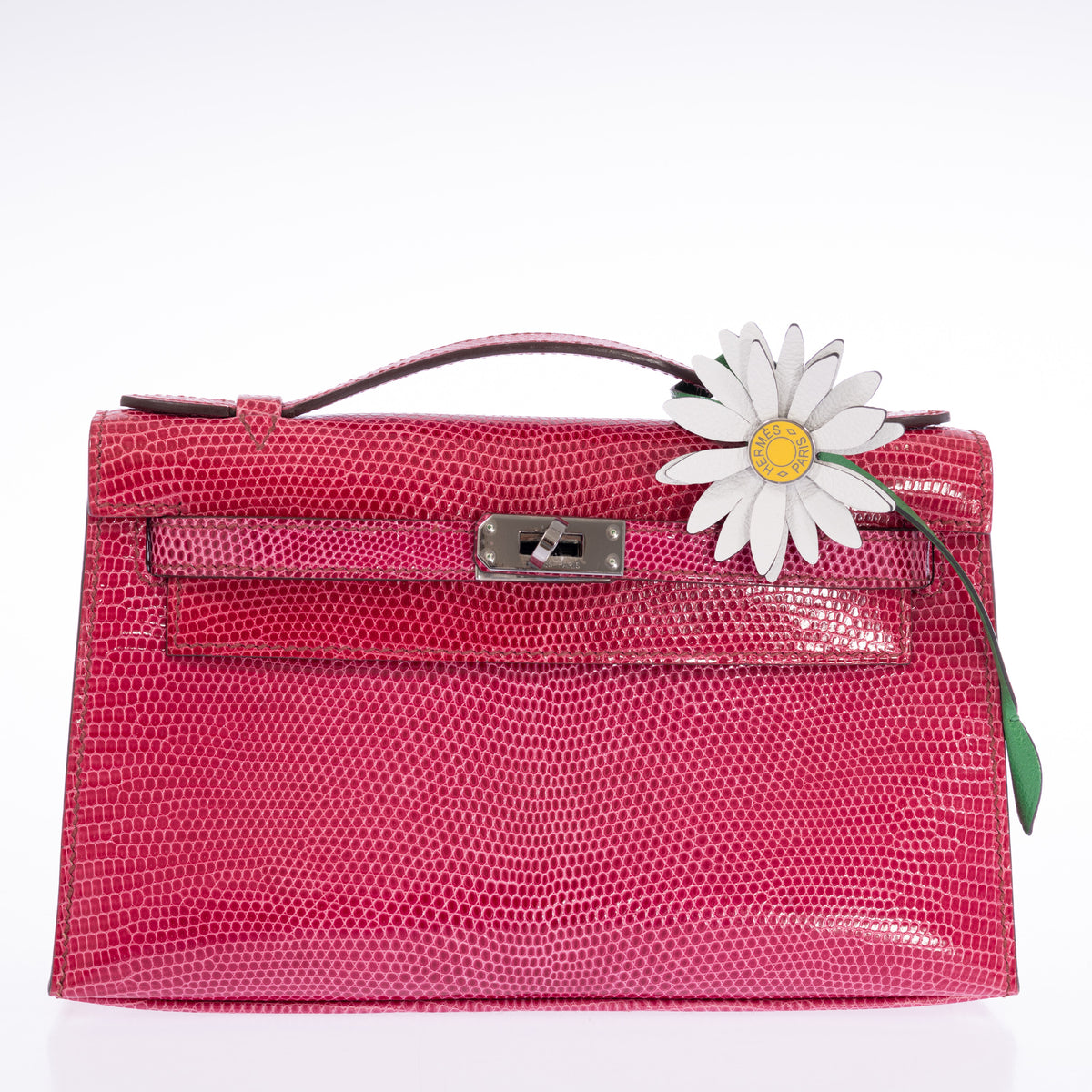 Hermès Kelly Pochette Fuchsia Shiny Niloticus Lizard Palladium Hardware, front view, styled with a daisy charm, sold separately