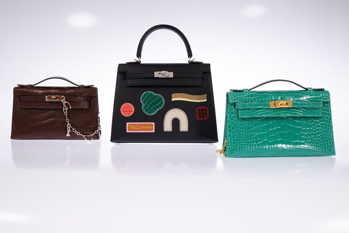 Hermès Kelly Pochette in Havane matte alligator, photographed beside two other Kelly bags for scale.