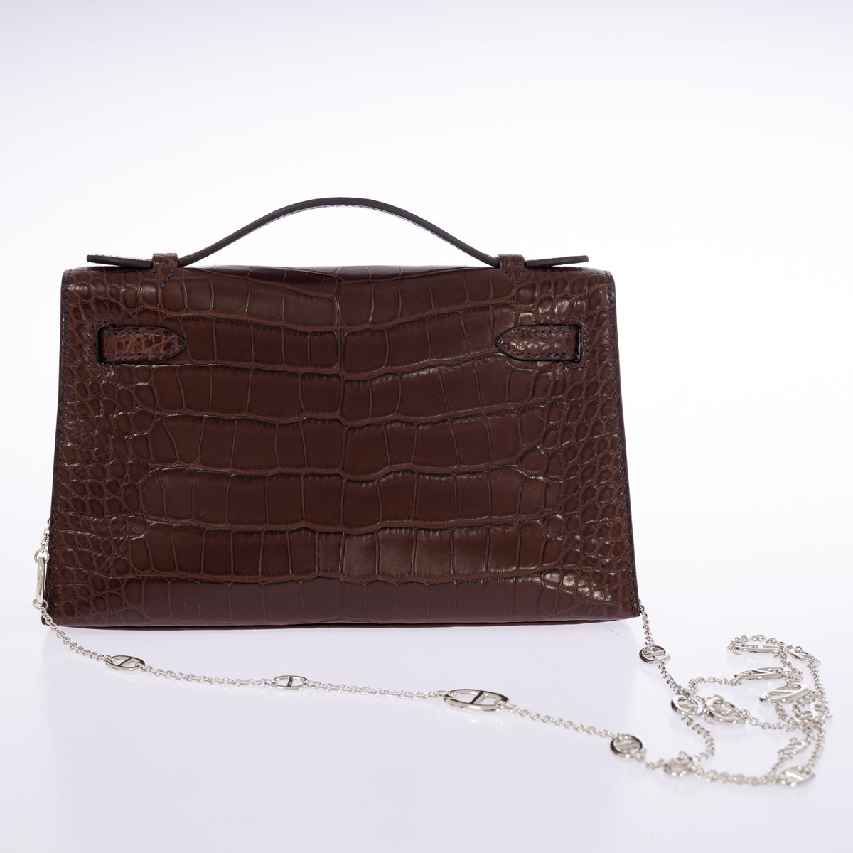 Hermès Kelly Pochette in Havane matte alligator, back view.