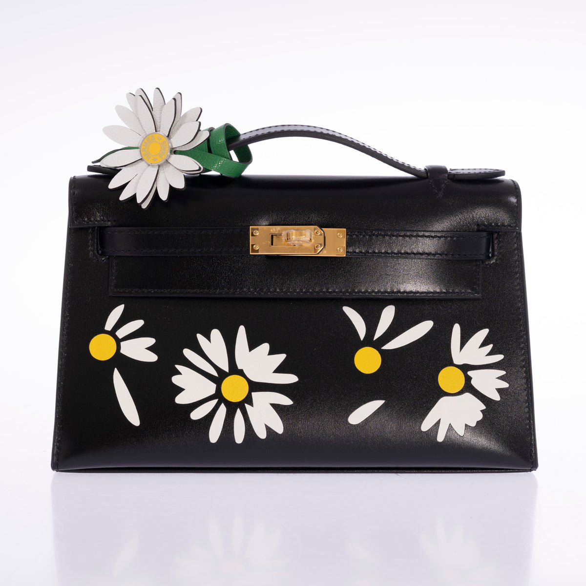 Hermès Kelly Pochette Marqueterie Marguerite Noir Box Gold Hardware, front view with a marguerite charm on the handle, charm sold separately