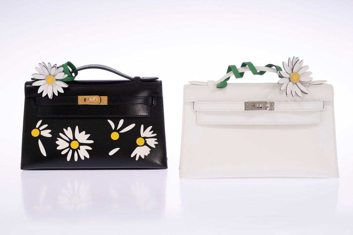 Hermès Kelly Pochette Marqueterie Marguerite Noir Box Gold Hardware, shown alongside a Kelly Pochette, other bag sold separately