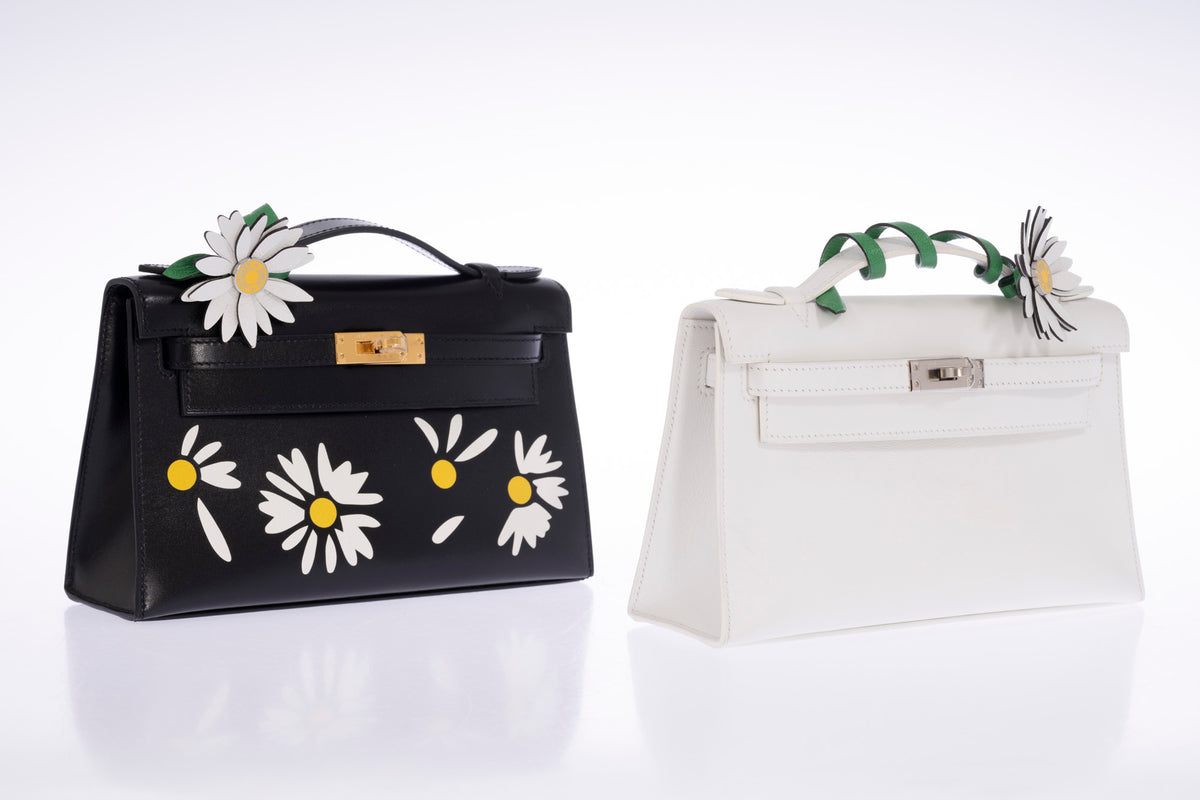 Hermès Kelly Pochette Marqueterie Marguerite Noir Box Gold Hardware, shown alongside a Kelly Pochette, both with marguerite charms, other bag and charms sold separately