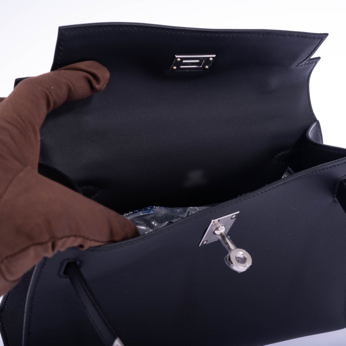 Hermès Kelly Pochette Noir Swift Palladium Hardware, interior with the flap open
