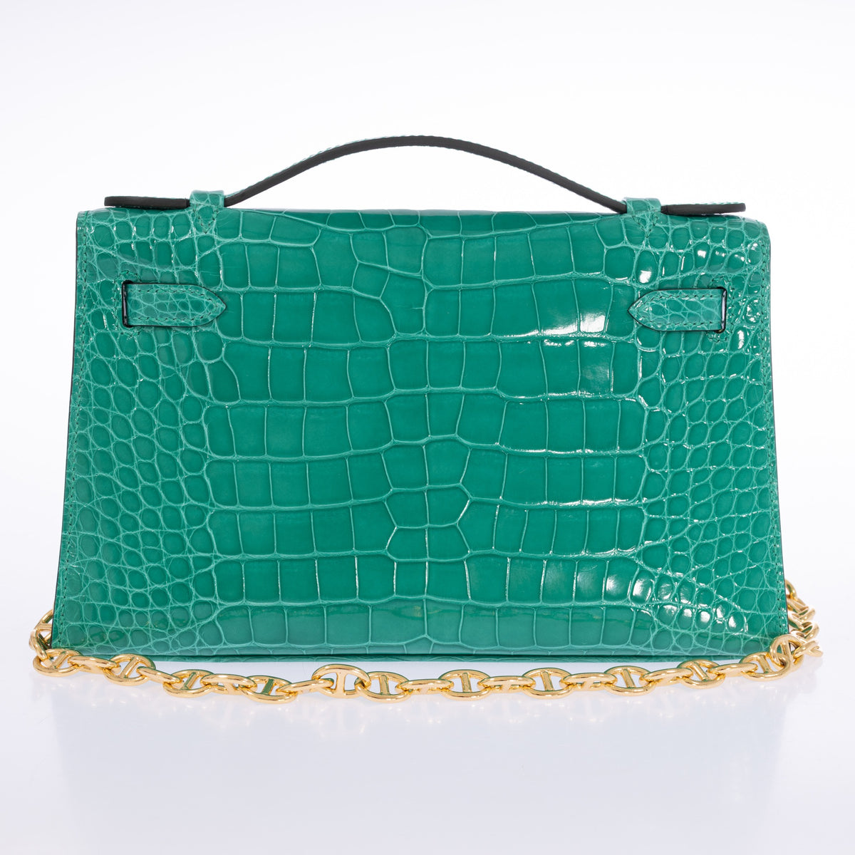 Hermès Kelly Pochette in Vert Jade shiny alligator with gold hardware, rear view with chain styling.