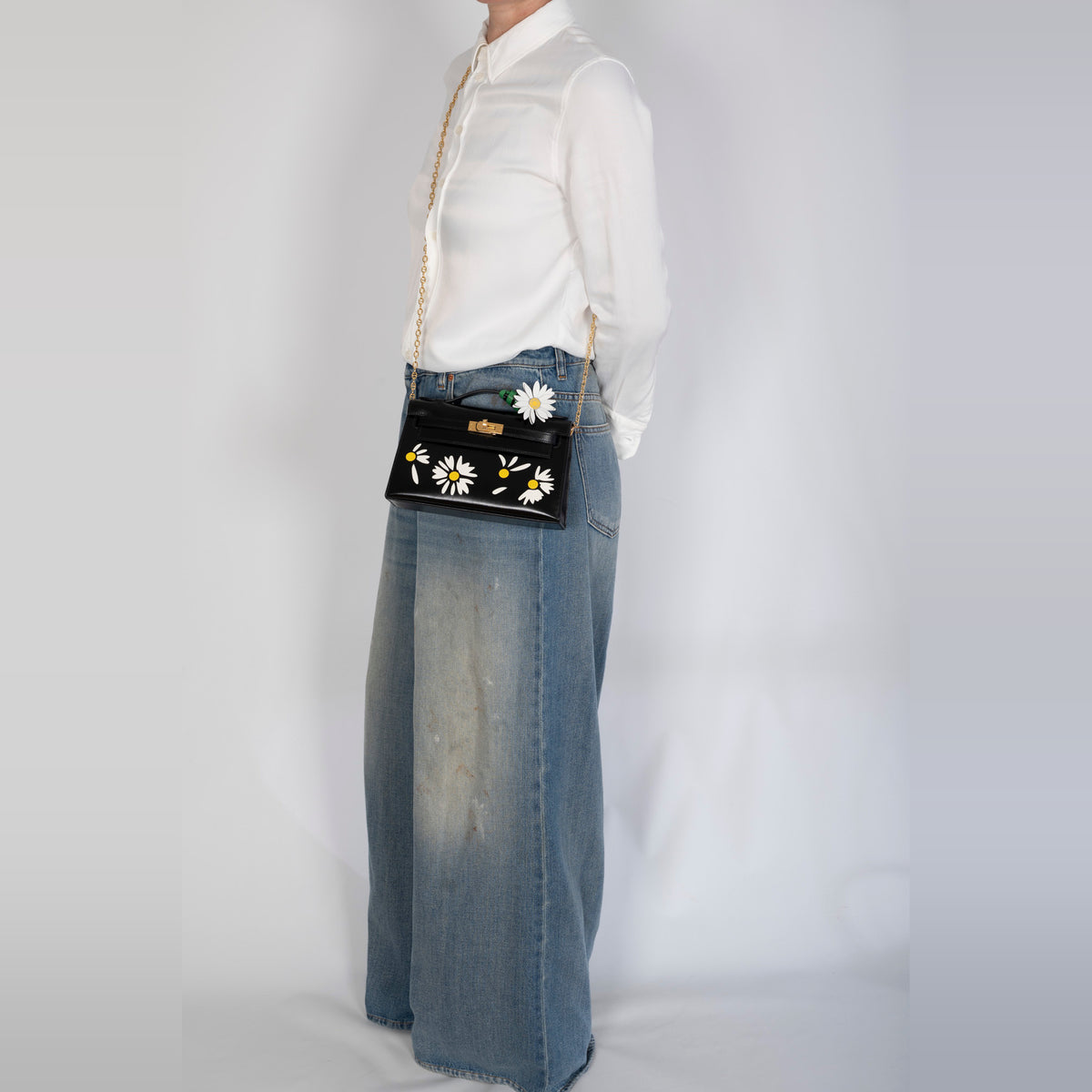 Hermès Marguerite Daisy Charm White Jaune de Naples Bambou, on a Kelly Pochette worn crossbody on a chain, bag and chain sold separately