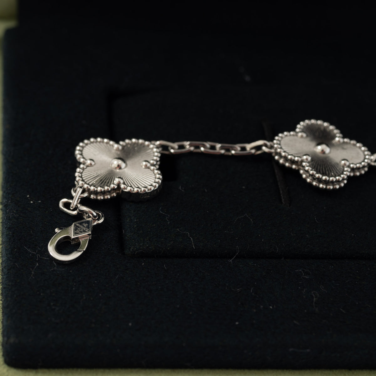 Van Cleef & Arpels Vintage Alhambra 5-Motif Guilloché Bracelet 18K White Gold, close view of the clasp and engraved motifs