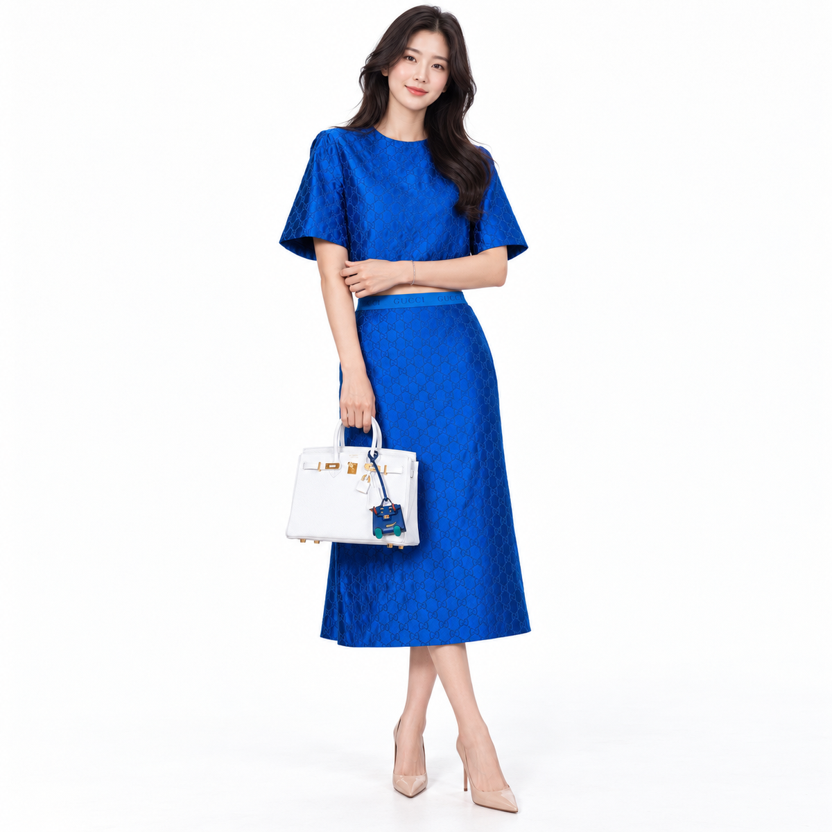 Hermès HSS Birkin 25 White Togo and Rose Pourpre Interior with Brushed Gold Hardware shown on a model