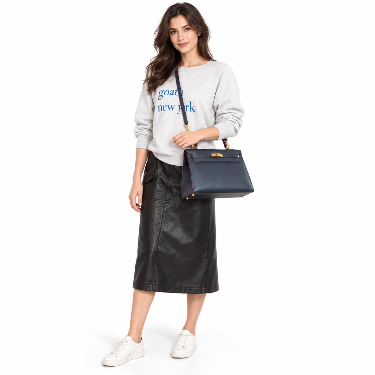 Hermès Kelly 32 Sellier Contour Blue Indigo Epsom Gold Hardware modeled in a white studio
