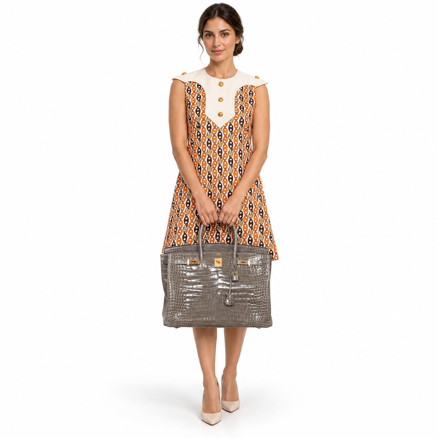 Hermès Birkin 40 Gris Tourterelle Shiny Porosus Crocodile Gold Hardware shown on a model