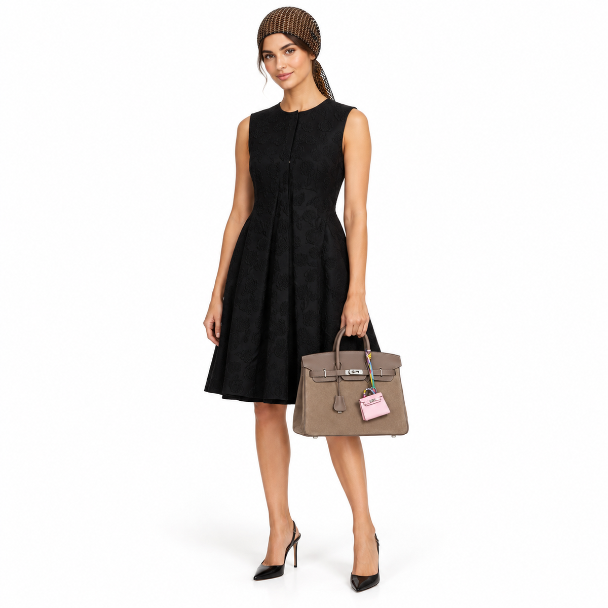 Hermès Micro Kelly Twilly Bag Charm Rose Sakura Tadelakt Palladium Hardware shown on a model