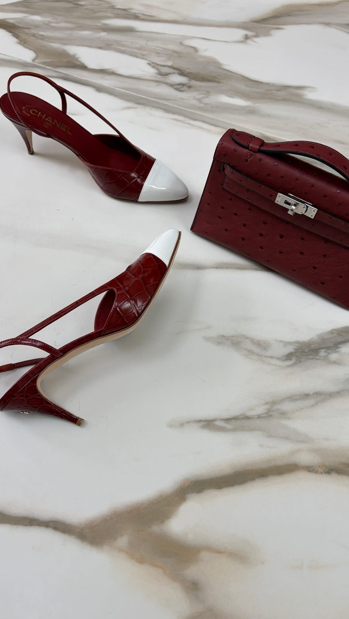 JANEFINDS Instagram: a burgundy Kelly Pochette beside slingback heels on marble