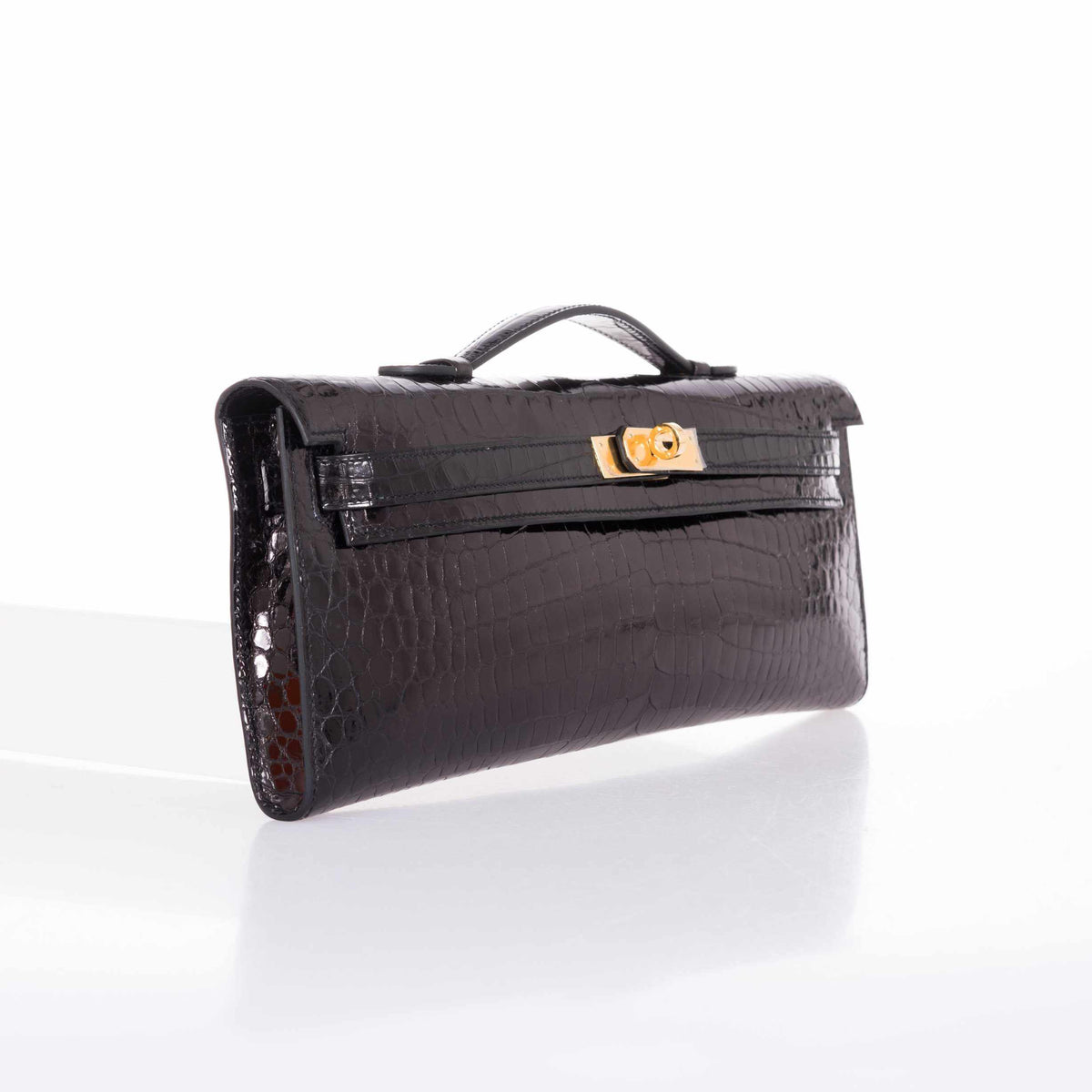 Hermès Kelly Cut Noir Shiny Porosus Crocodile Gold Hardware, three-quarter view